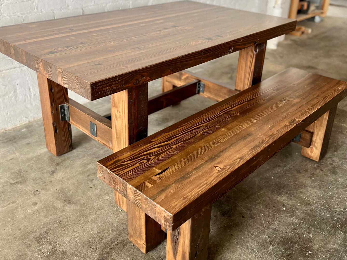 Ambassador Dining Table and Bench Set from Workshop Detroit - Made from solid wood sustainably-sourced reclaimed lumber - Shown in a walnut stain finish