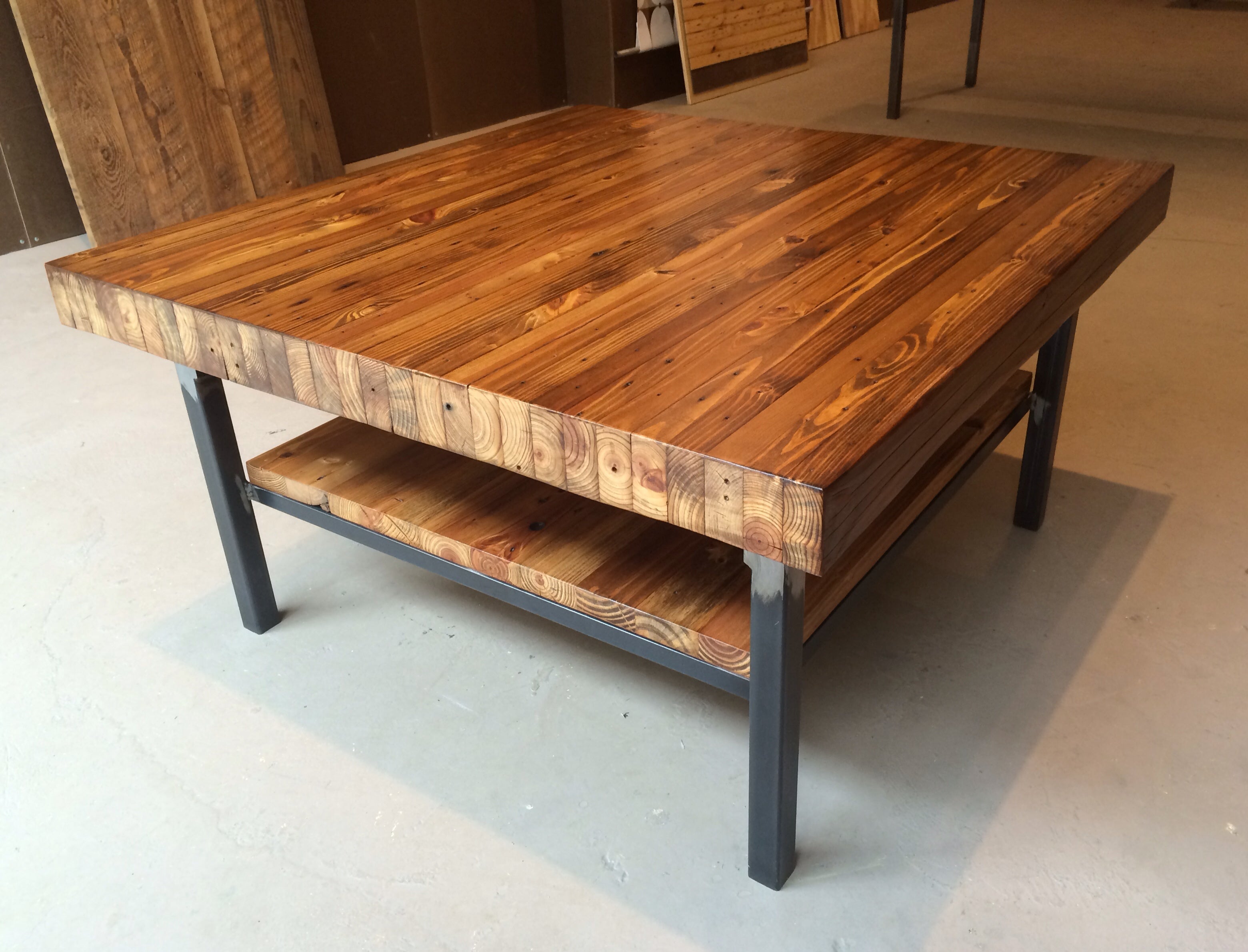 Reclaimed farmhouse style wood and steel coffee table with shelf - Made from reclciamed wood and shown in a walnut stain finish